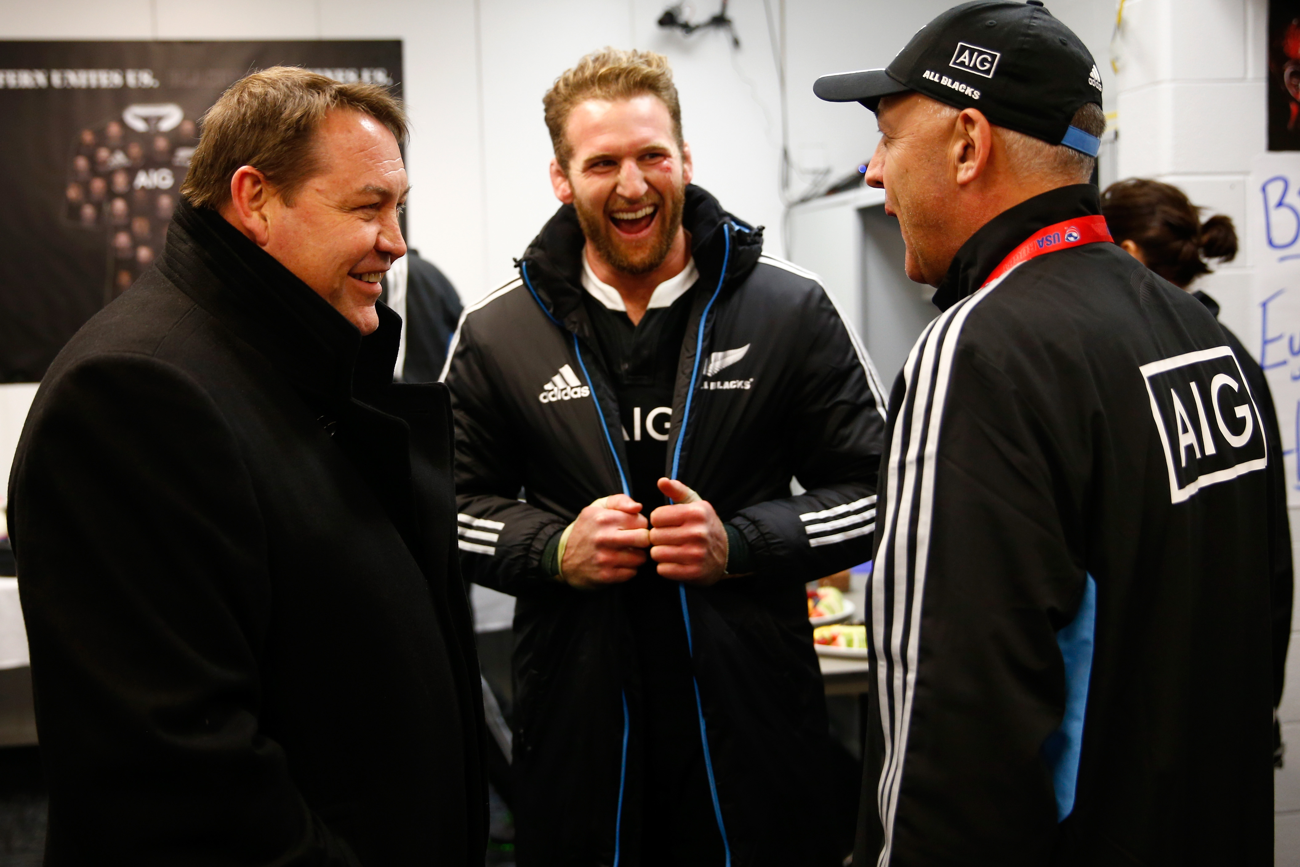All Blacks captain Kieran Read laughing with coach Steve Hansen and assistant manager Gilbert Enoka in the dressing room.