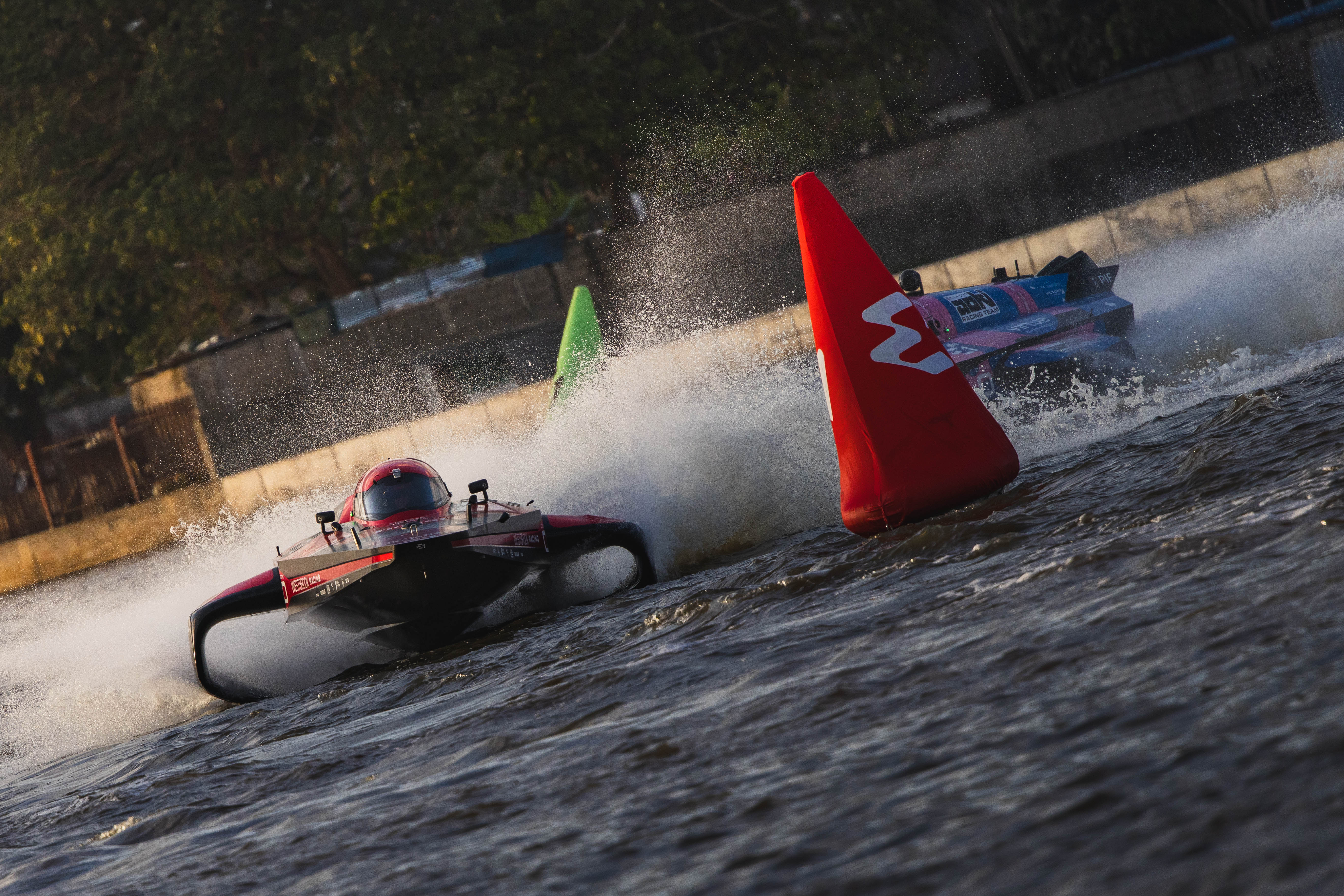 Two E1 RaceBird powerboats, number 88 Westbrook Racing with drivers Lucas Ordonez and Sara Price, racing during the E1 Lagos GP.