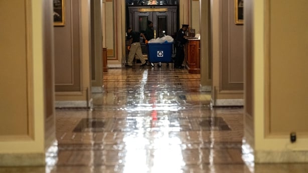 A cleaning worker is seen in Capitol Hill