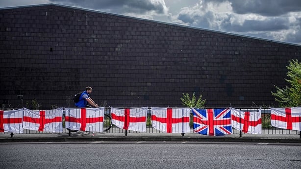 WALSALL, UNITED KINGDOM - SEPTEMBER 09: The flag of St George, the flag of England, is displayed on railings on September 09, 2025 in Walsall, United Kingdom. An online movement called 'Operation Raise the Colours' has inspired people across the UK to fly flags. It has been reported that some counci