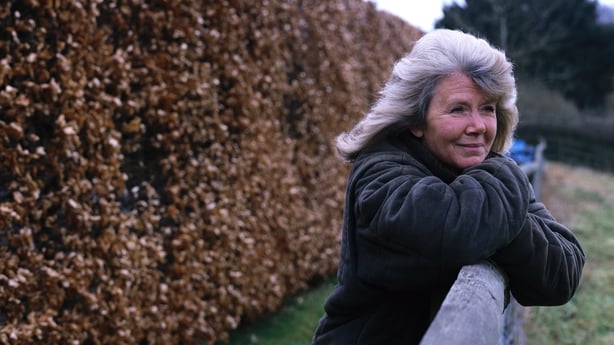 Jilly Cooper poses for a photograph leaning on a paddock fence at her home in Bisley, UK, 2000