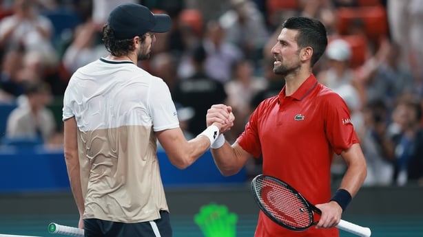 SHANGHAI, CHINA - OCTOBER 11: Novak Djokovic of Serbia shaking hands with Valentin Vacherot of Monaco in front net after hislose the Men's singles Semifinals on day 13 of the 2025 Shanghai Rolex Masters at Qi Zhong Tennis Center on October 11, 2025 in Shanghai, China. (Photo by Lintao Zhang/Getty I