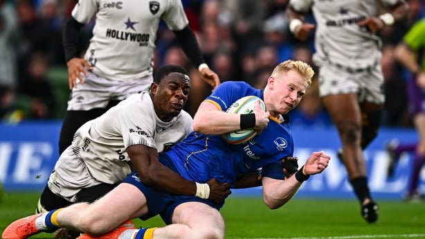 11 October 2025; Jamie Osborne of Leinster dives over to score his side's first try despite the efforts of Emmanuel Tshituka of Hollywoodbets Sharks during the United Rugby Championship match between Leinster and Hollywoodbets Sharks at the Aviva Stadium in Dublin. Photo by Tyler Miller/Sportsfile