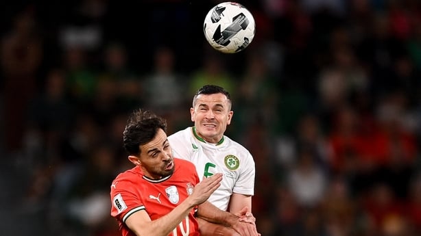 Josh Cullen of Republic of Ireland in action against Bernardo Silva of Portugal during the FIFA World Cup 2026 Group F qualifying match between Portugal and Republic of Ireland at Estádio José Alvalade in Lisbon, Portugal.