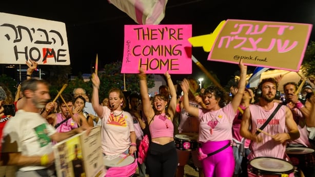 Protestors cheer in excitement of the hostages coming home at the end of weekly 'Bring Them Home' rally in Hostage Square Hostages Square on October 11, 2025 in Tel Aviv, Israel. This week's ceasefire deal between Israel and Hamas has brought an end to the two years of war that followed the attacks 