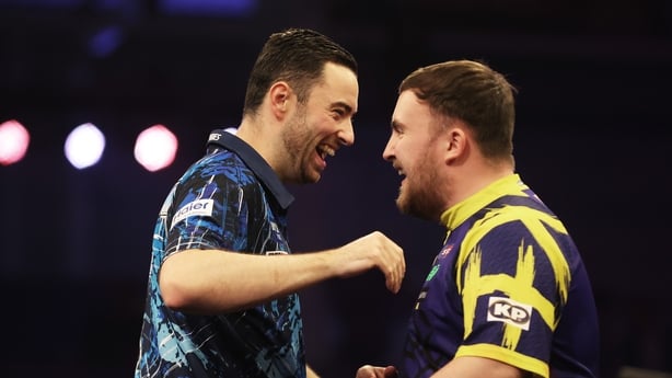 Luke Humphries interacts with Luke Littler prior to the Final match on day seven of the Boyle Sports World Grand Prix at Mattioli Arena on October 12, 2025 in Leicester, England.