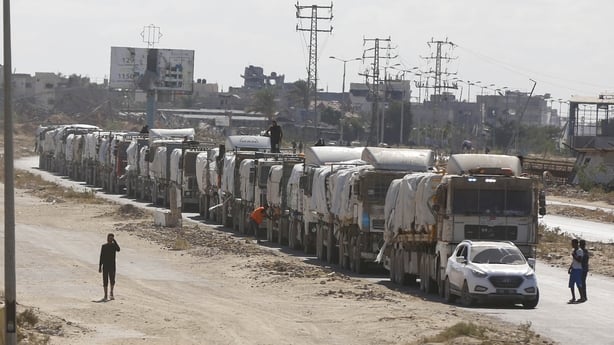 Trucks loaded with humanitarian aid supplies arrive in Gaza through the Kissufim Border Crossing