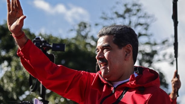 Nicolás Maduro greets his supporters during a rally to commemorate Indigenous Resistance Day
