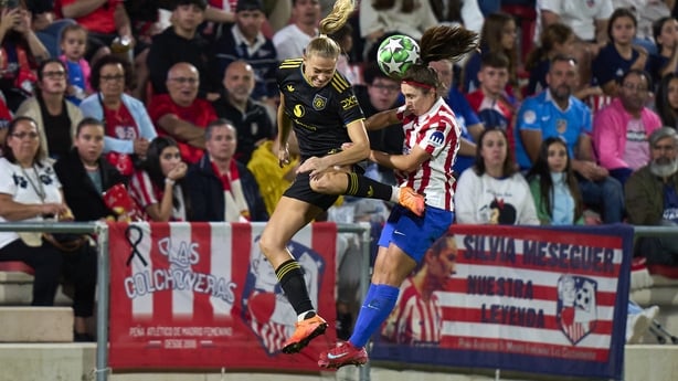 Manchester United goalscorer Fridolina Rolfo challenges Alexia Fernandez of Atletico de Madrid in the air