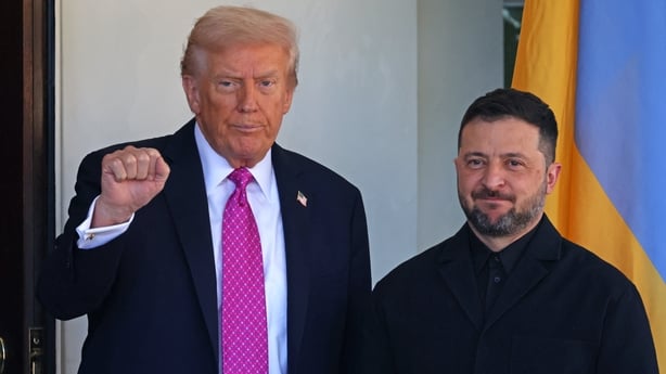 US President Donald Trump gestures as he greets Ukrainian President Volodymyr Zelensky as he arrives for a meeting at the White House in Washington, DC