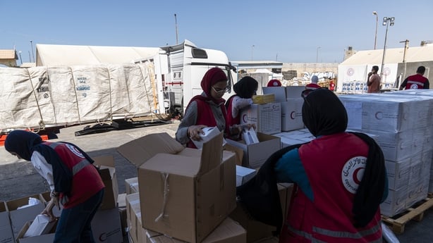 ARISH, EGYPT - OCTOBER 16: Members of the Egyptian Red Crescent pack aid at the aid warehouse in Al-Arish near the Rafah crossing on October 16, 2025 in Arish, Egypt. The crossing is a key corridor for humanitarian relief and is also scheduled to reopen to pedestrian traffic for Gazans exiting and e