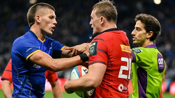18 October 2025; Sam Prendergast of Leinster, left, and Gavin Coombes of Munster during the United Rugby Championship match between Leinster and Munster at Croke Park in Dublin. Photo by Brendan Moran/Sportsfile