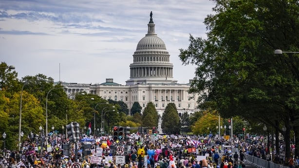Protesters march along Pennsylvania Avenue during the second 