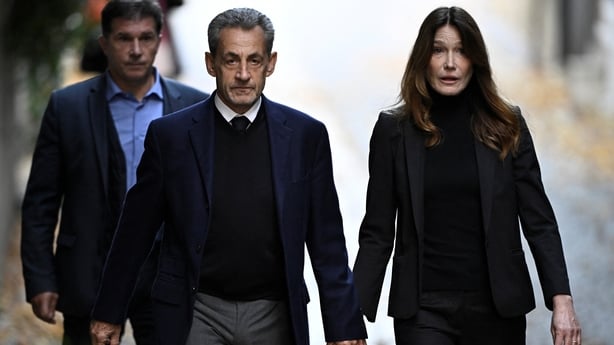 Nicolas Sarkozy with his wife Carla Bruni-Sarkozy leaving his residence