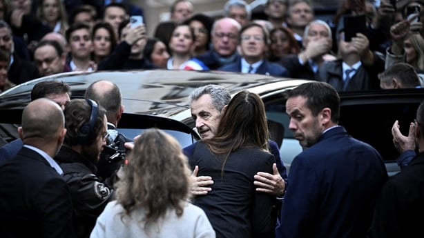 Nicolas Sarkozy hugs his wife Carla Bruni-Sarkozy