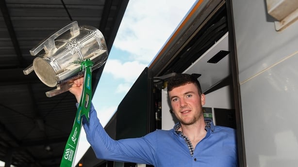 Team captain Declan Hannon with the Liam MacCarthy Cup as the Limerick squad depart from Heuston Train Station, Dublin. 