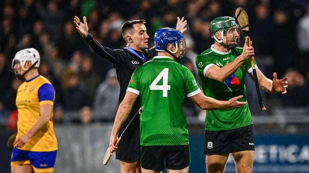 25 October 2025; Referee Rory Hanley signals for a penalty to Na Fianna as Lucan Sarsfields players John Bellew, 4, and Chris Crummey remonstrate with him during the Dublin County Senior Club Hurling Championship final match between Na Fianna and Lucan Sarsfields at Parnell Park in Dublin. Photo by 