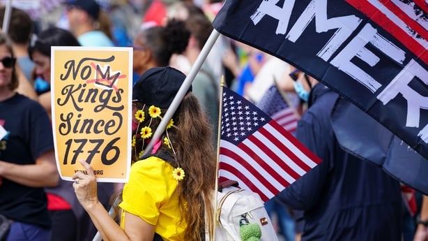 Demonstrators hold protest signs in atlanta georgia