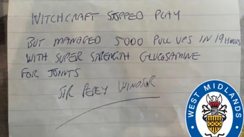 West Midlands Police/PA Media A paper letter with handwriting in blue biro pen. The letter reads: "Witchcraft stopped play but managed 5,000 pull ups in 19 hours with super strength glucosamine for joints."