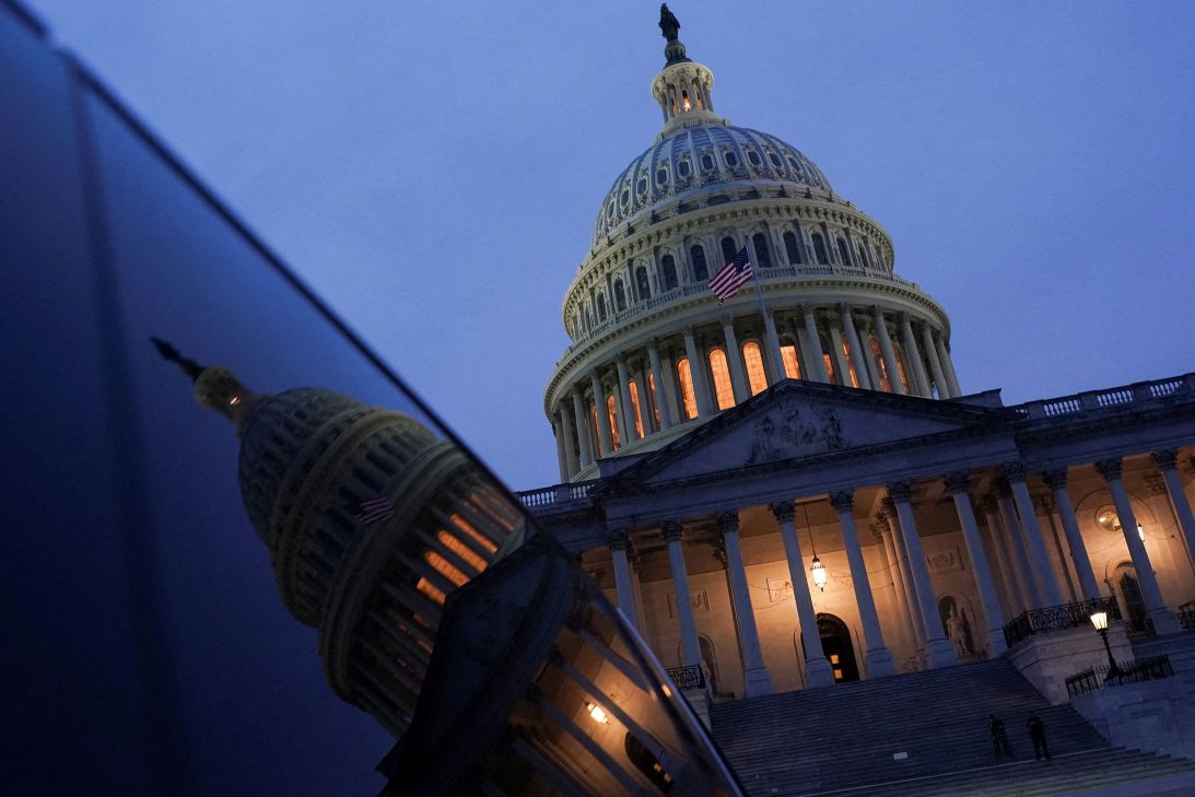 The sun sets behind the US Capitol, on Monday.