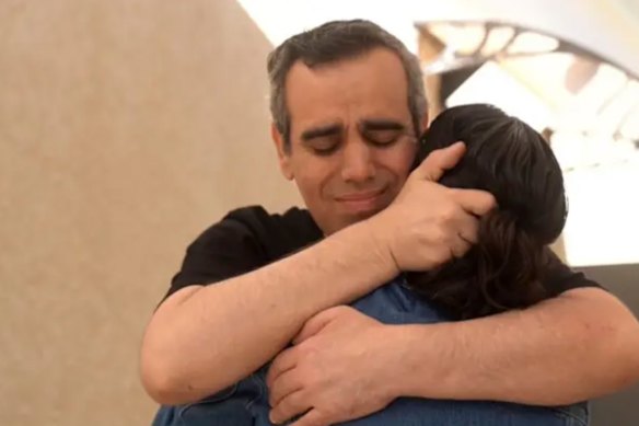 Hostage Omri Miran, 48, reunites with wife Lishay at the initial reception point in southern Israel.