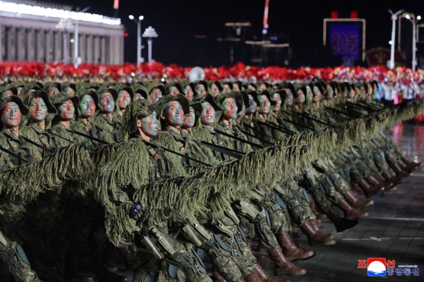 Troops parade through Kim Il Sung Square in Pyongyang on October 10, 2025 as part of a huge North Korean military parade.