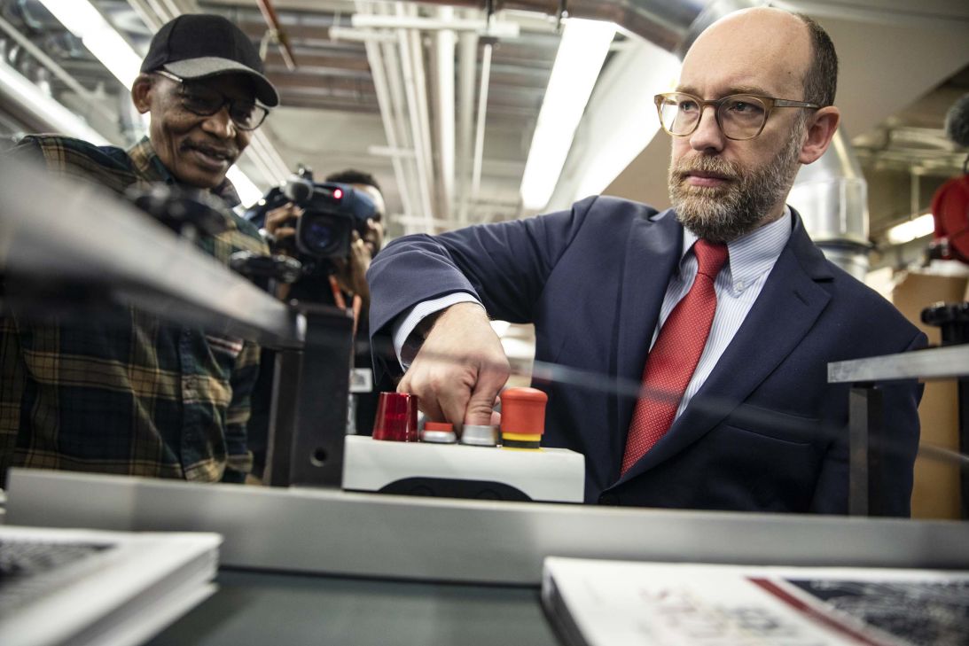 Russ Vought, then the acting director of the Office of Management and Budget during President Donald Trump's first term, presses the button to start the machine that will print copies of Trump's proposed budget for the US Government for the 2021 Fiscal Year, at the Government Publishing Office in Washington, DC, on February 6, 2020.
