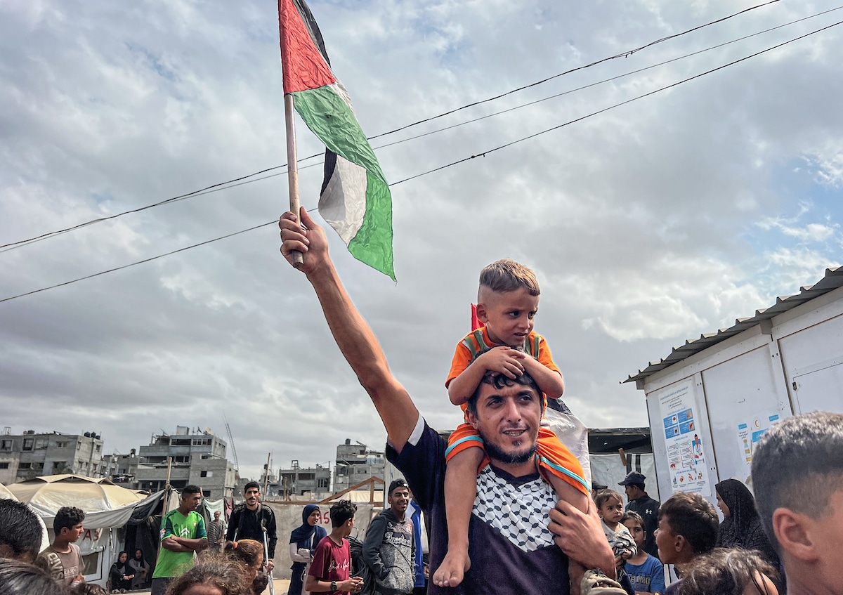 Palestinians celebrate in Nusairat Camp on October 9, 2025, following news of a new Gaza ceasefire deal. (Photo: Belal Abu Amer/APA Images)