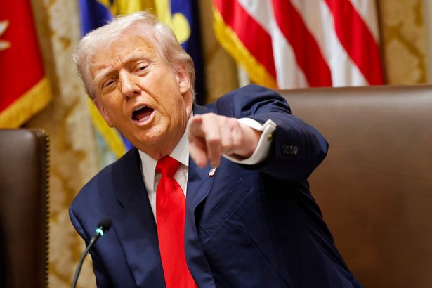 U.S. President Donald Trump gestures during a meeting