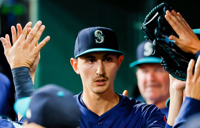 Seattle Mariners starting pitcher George Kirby gets high-fives from his teammates after getting out of a two men on jam during the sixth inning Saturday, Sept. 20, 2025 in Houston. 231196 231196