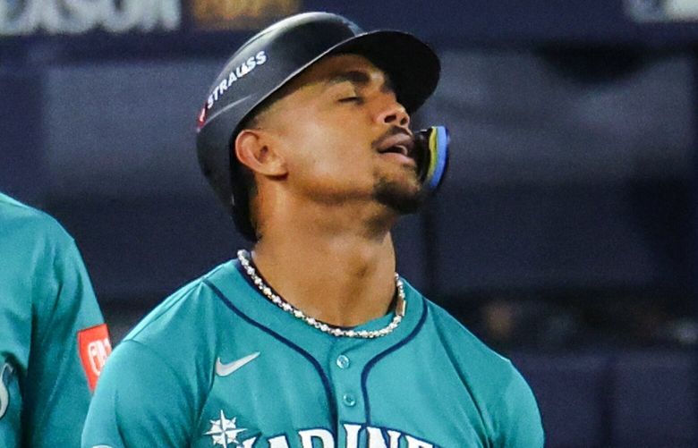 Seattle Mariners center fielder Julio Rodríguez reacts after flying out to retire the side in the seventh during Game 6 of baseball’s American League Championship Series on Sunday, Oct. 19, 2025, in Toronto.