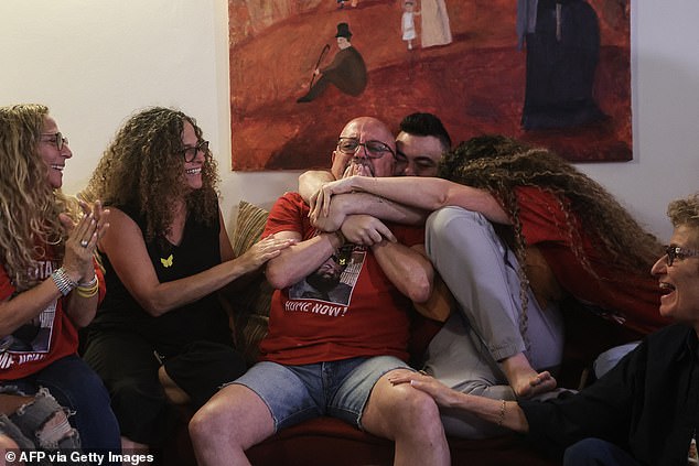 Family and friends of Israeli hostage Eitan Horn react to the news of his release at their house in the central Israeli city of Rosh Haayin on October 13, 2025
