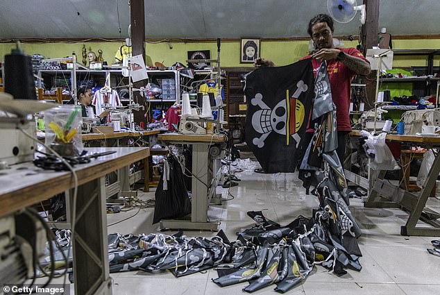 A T-shirt workshop knocking out orders for the anime Jolly Roger symbol in Central Java, Indonesia