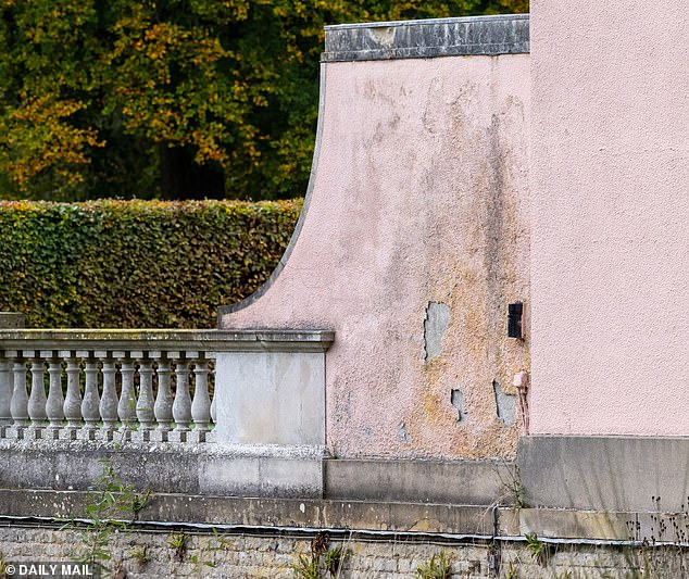 Crumbling paintwork is also seen on the exterior walls of the gatehouse at Royal Lodge