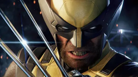 Marvel/Insomniac A screenshot shows Wolverine in close-up, dressed in his classic yellow costume with black trim. He is scowling as he holds up his trademark adamantium claws.