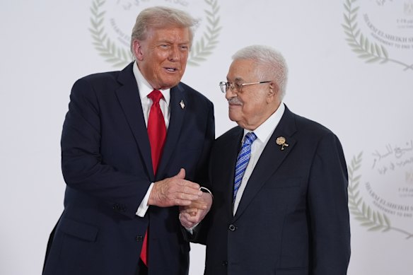 US President Donald Trump greets Palestinian President Mahmoud Abbas ahead of the peace summit in Egypt.