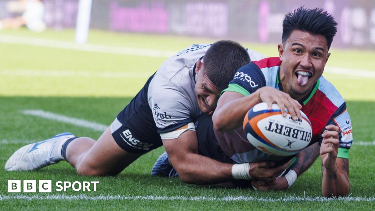 Harry Kane claps while playing for England