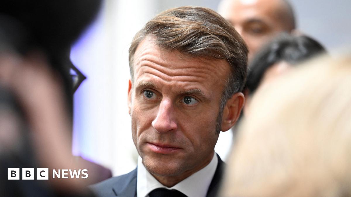 A headshot of Emmanuel Macron looking serious