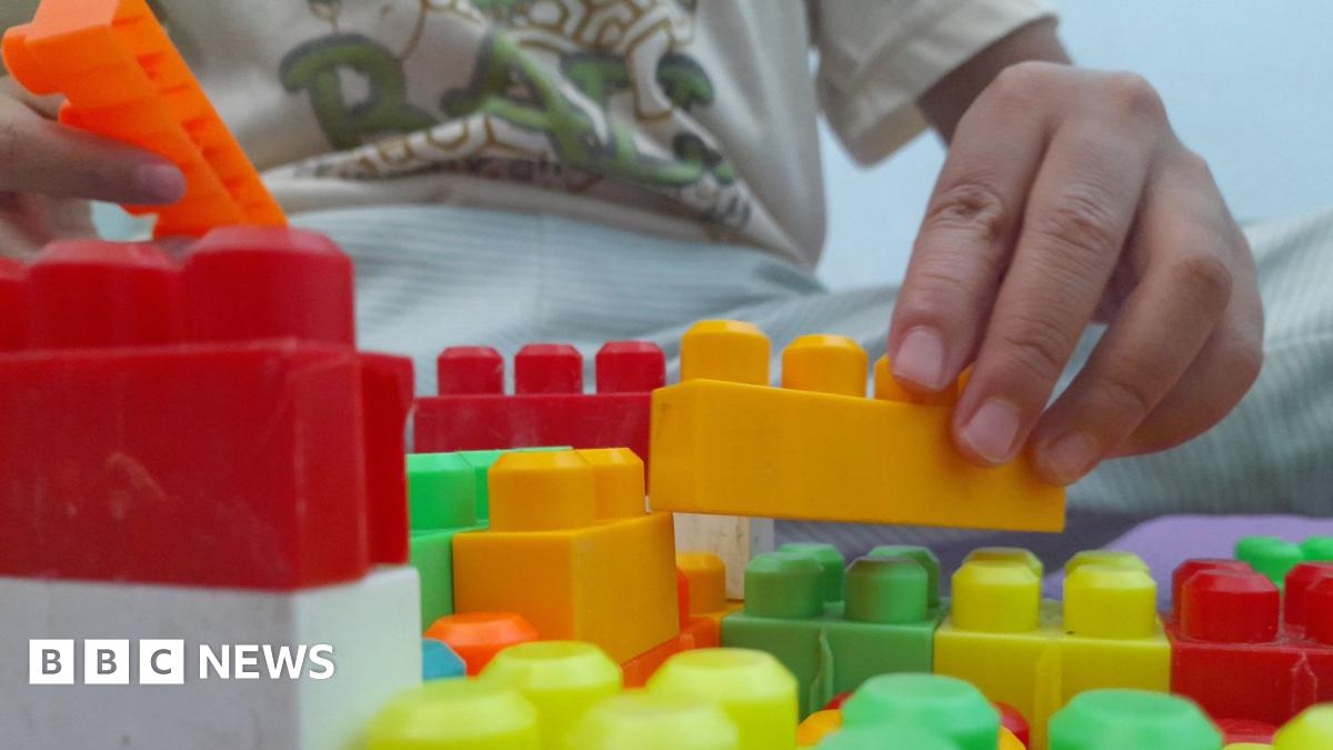 Child playing with building blocks