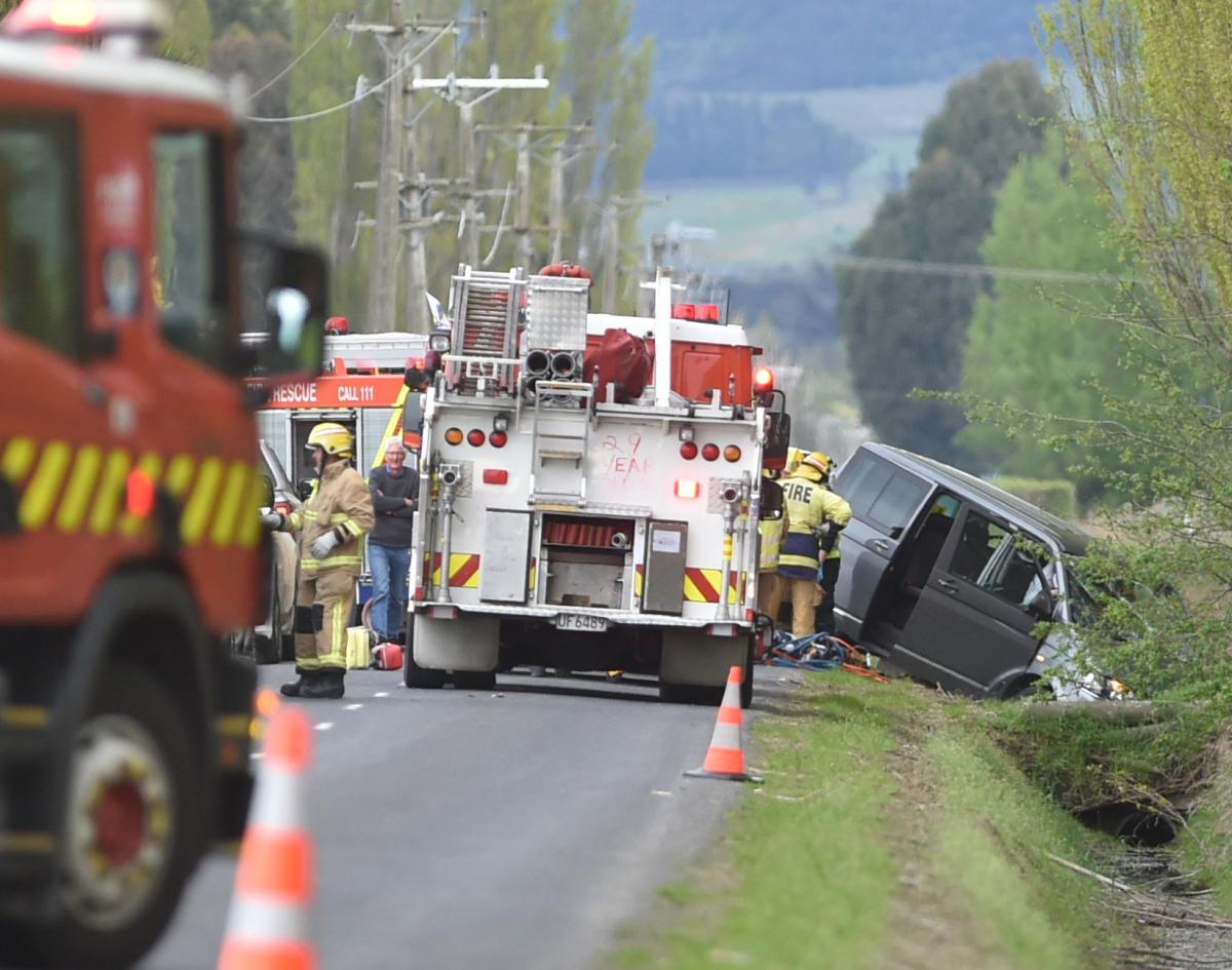 Two hurt as car crashes down bank