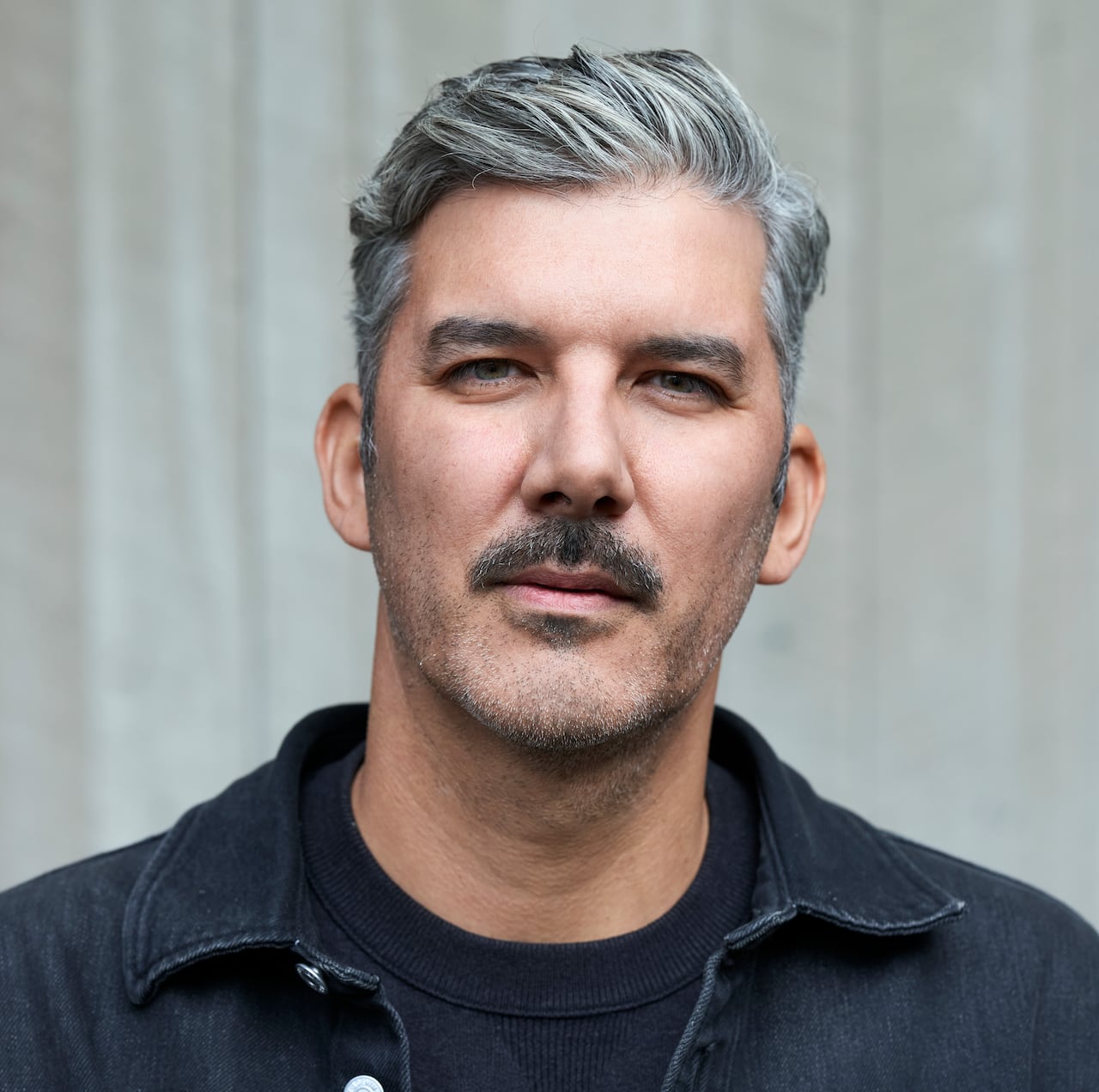 A man looks at the camera for a photo.