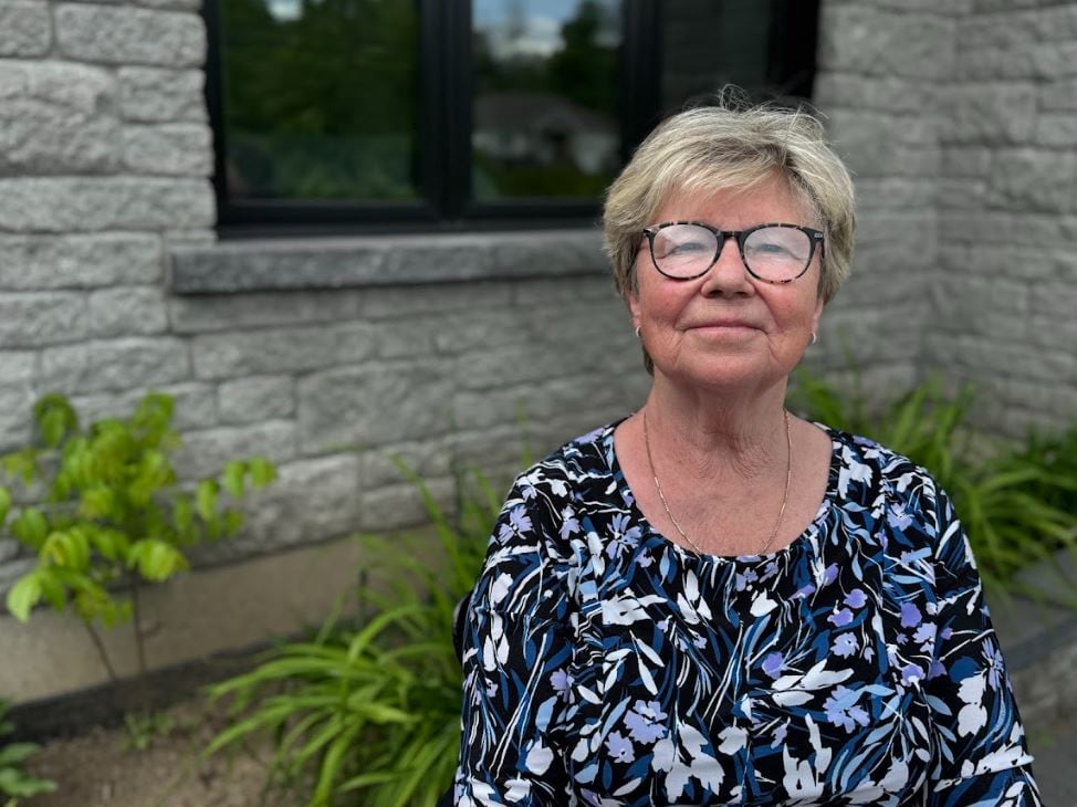   A rural town councillor sits outside in late spring.
