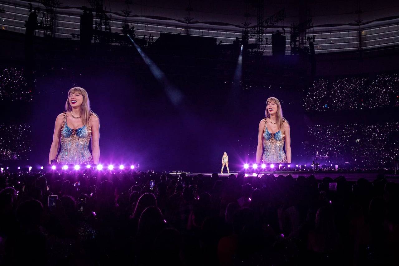 A woman stands on a stage.
