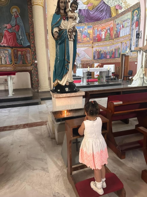 Child prays at Holy Family Church. Image: Latin Patriarchate Jerusalem