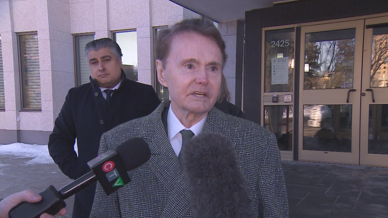 Regina lawyer Tony Merchant speaks to reporters outside Court of King's Bench of Saskatchewan.