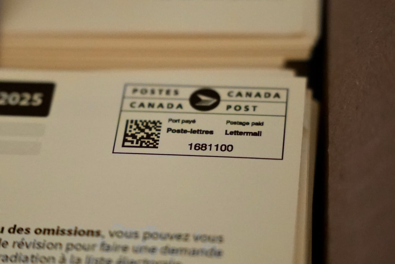 A close up image of a voter card showing the Canada Post stamp.