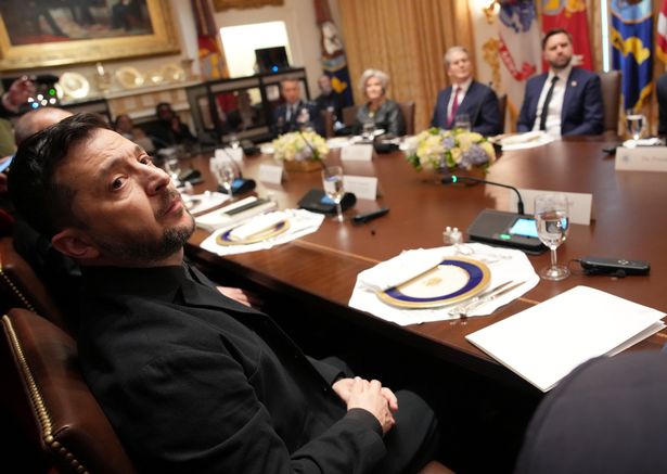 Ukrainian President Volodymyr Zelensky (L) looks on during a meeting with U.S. President Donald Trump and members of his Cabinet at the White House on October 17, 2025