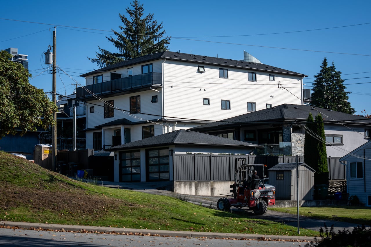 A close to complete new multiplex home with a balcony at the back