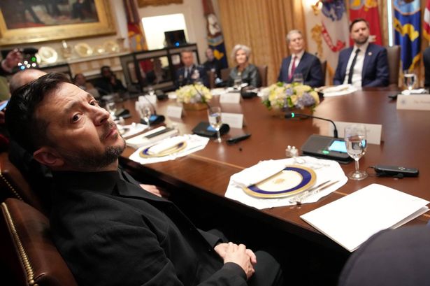 Ukrainian President Volodymyr Zelensky (L) looks on during a meeting with U.S. President Donald Trump and members of his Cabinet at the White House on October 17, 2025