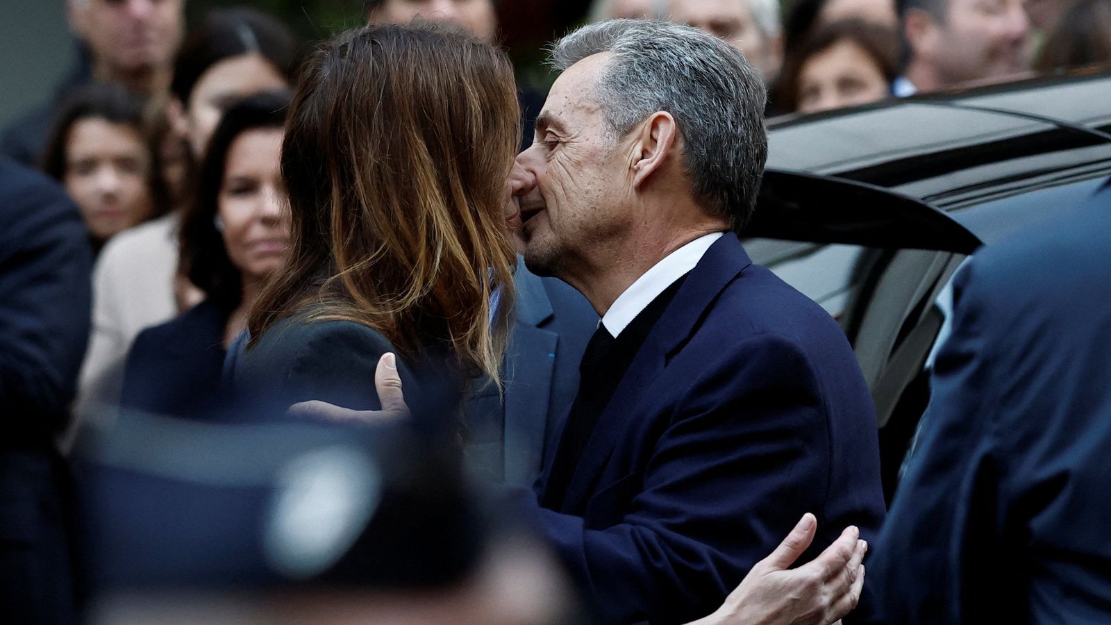Former French President Nicolas Sarkozy kisses his wife Carla Brun-Sarkozy. Pic: Reuters